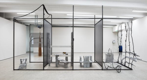 general view of the exhibition with a large metal structure in the gallery space